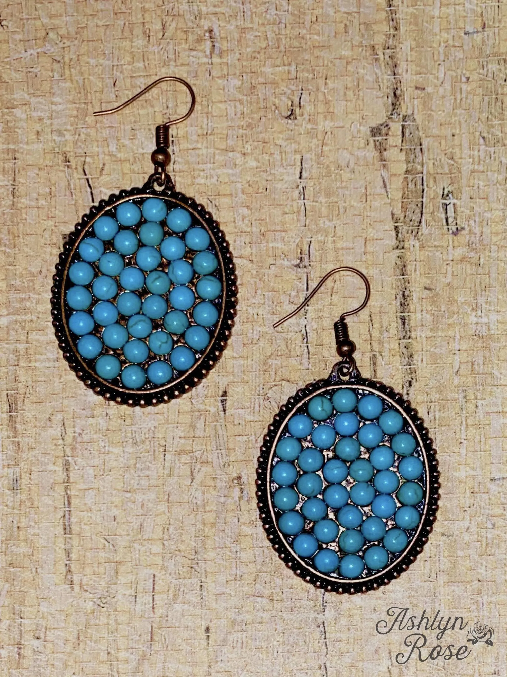 Bumpily Bamboozled Bronze Earrings With A Turquoise Pendant