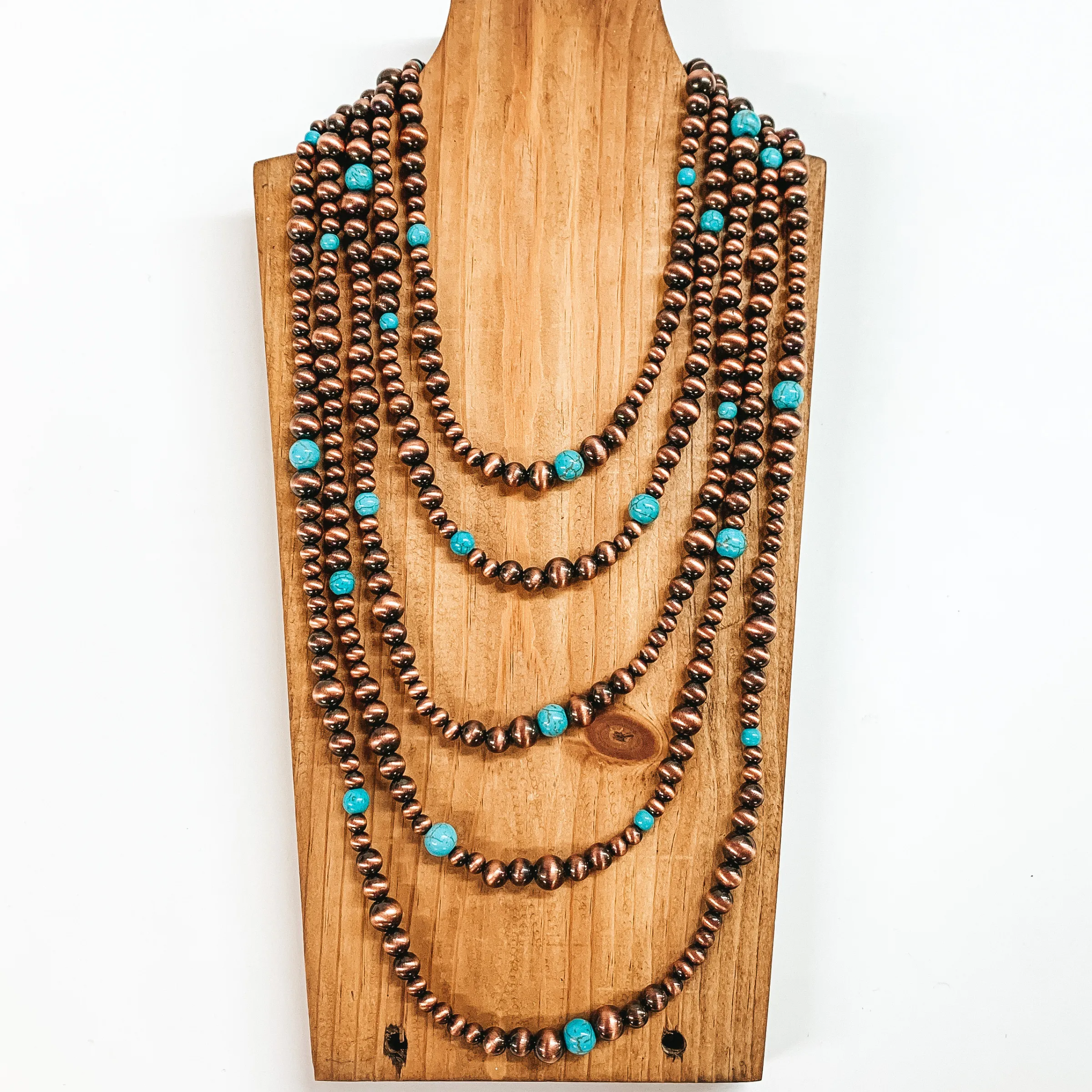 Five Strand Beaded Necklace with Turquoise Spacers in Copper Tone