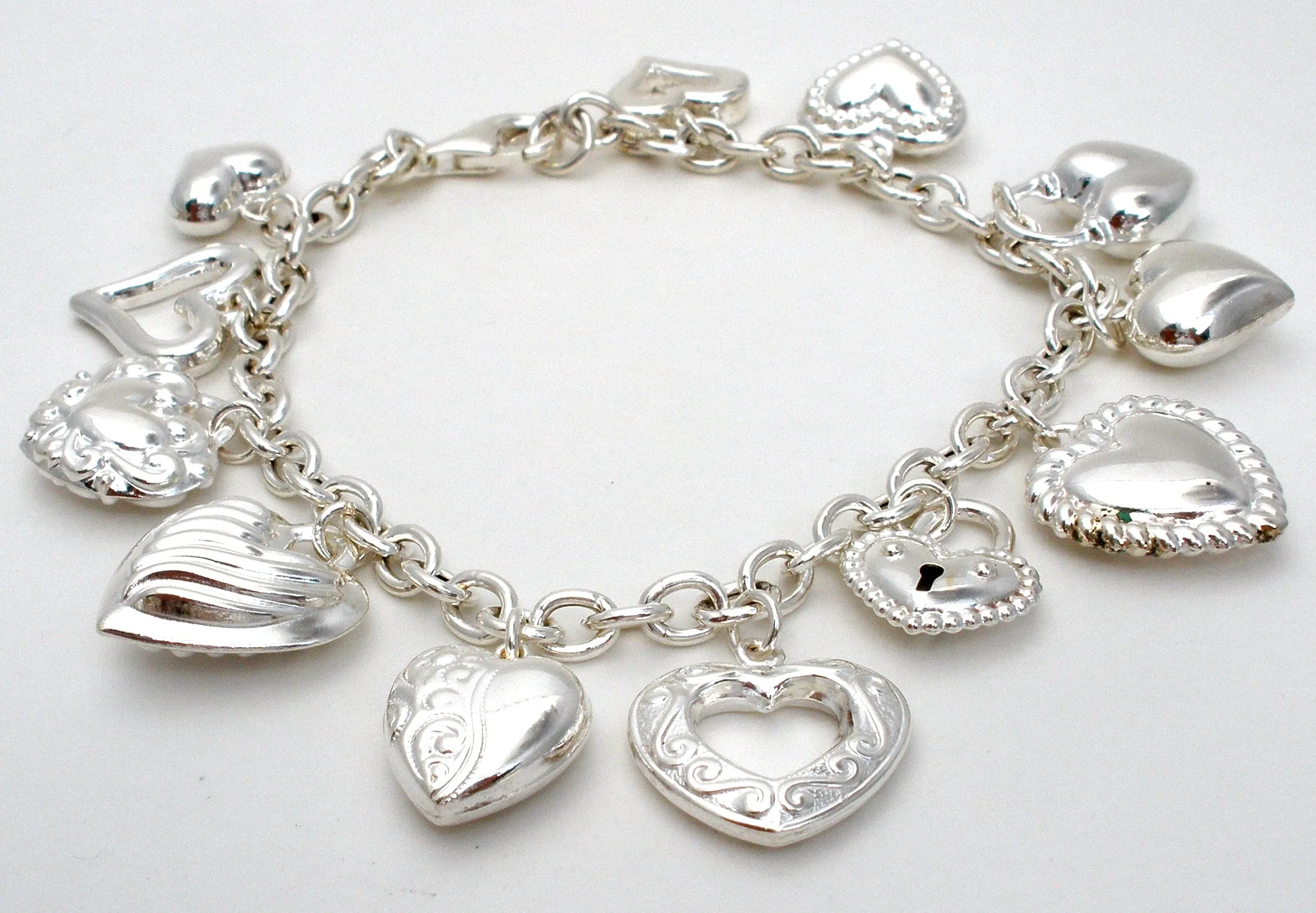 Sterling Silver Charm Bracelet with Hearts JCM