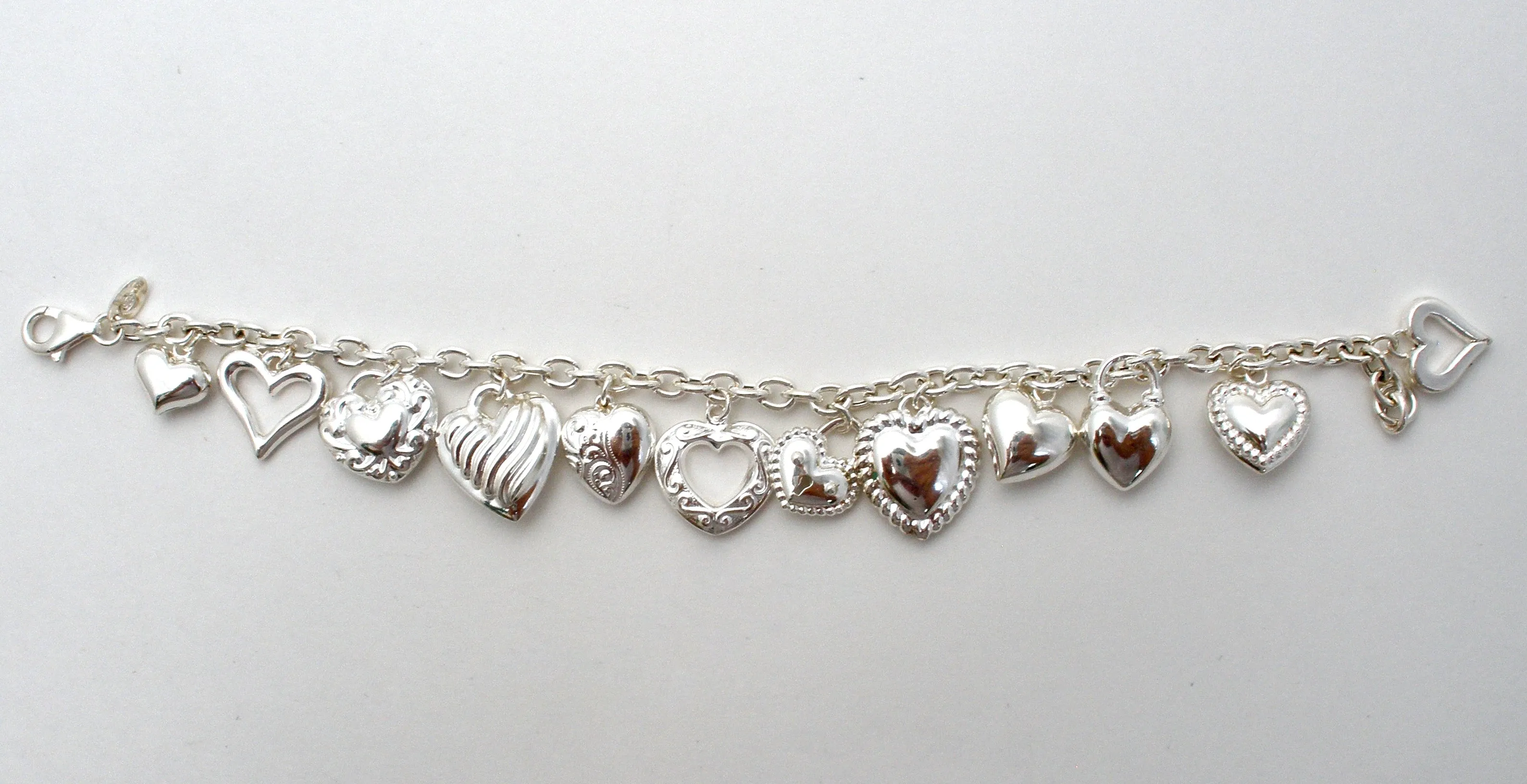 Sterling Silver Charm Bracelet with Hearts JCM