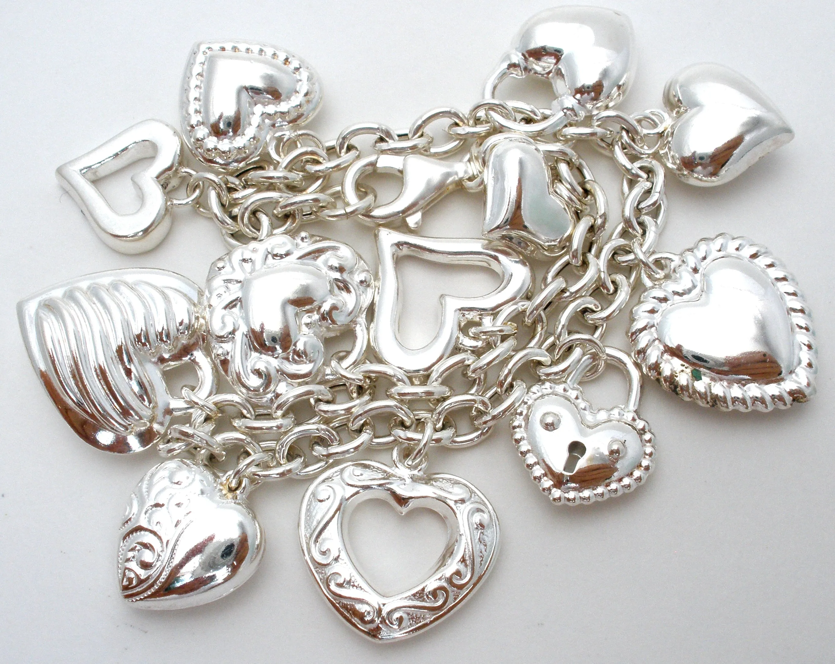 Sterling Silver Charm Bracelet with Hearts JCM