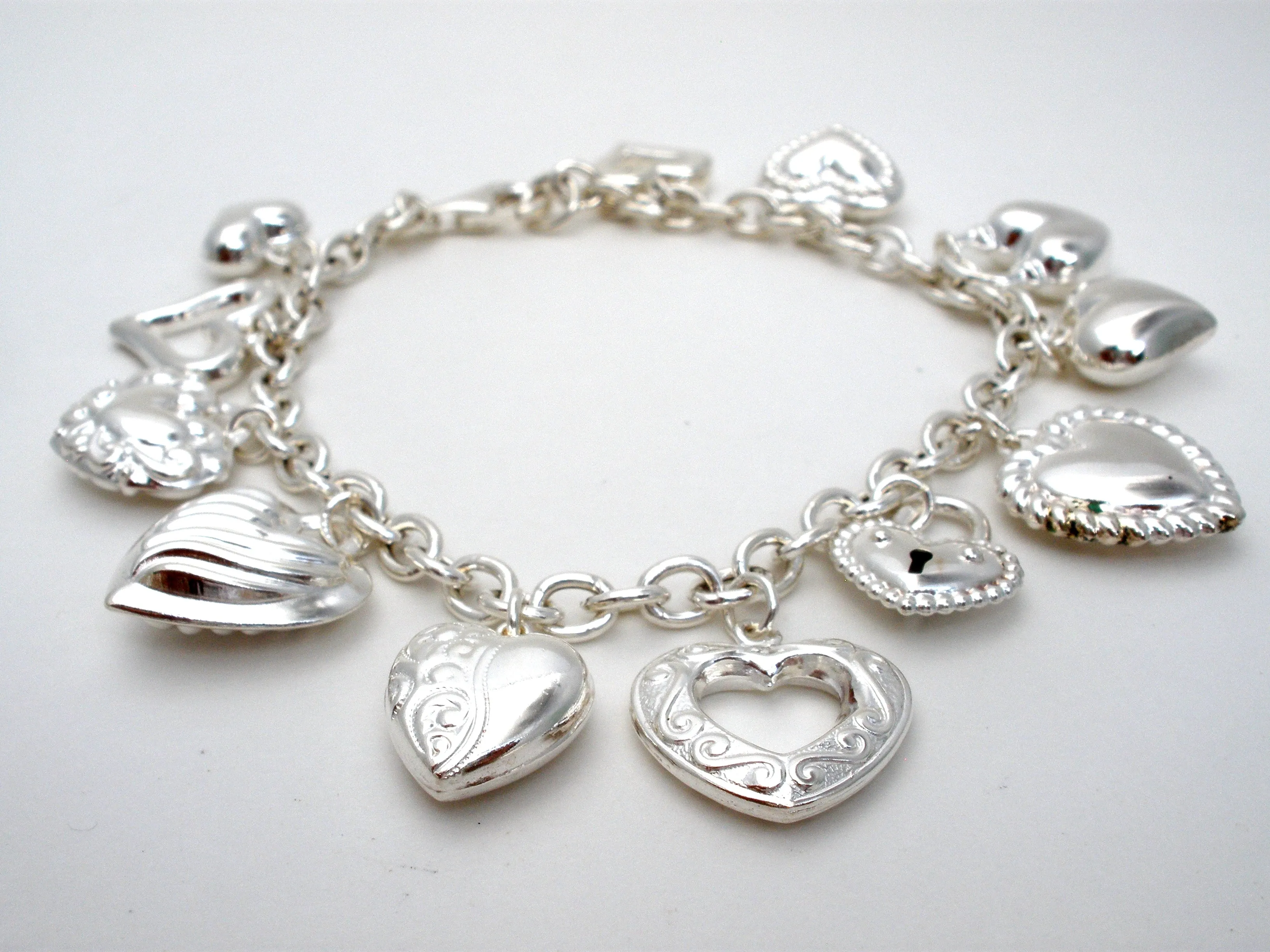 Sterling Silver Charm Bracelet with Hearts JCM