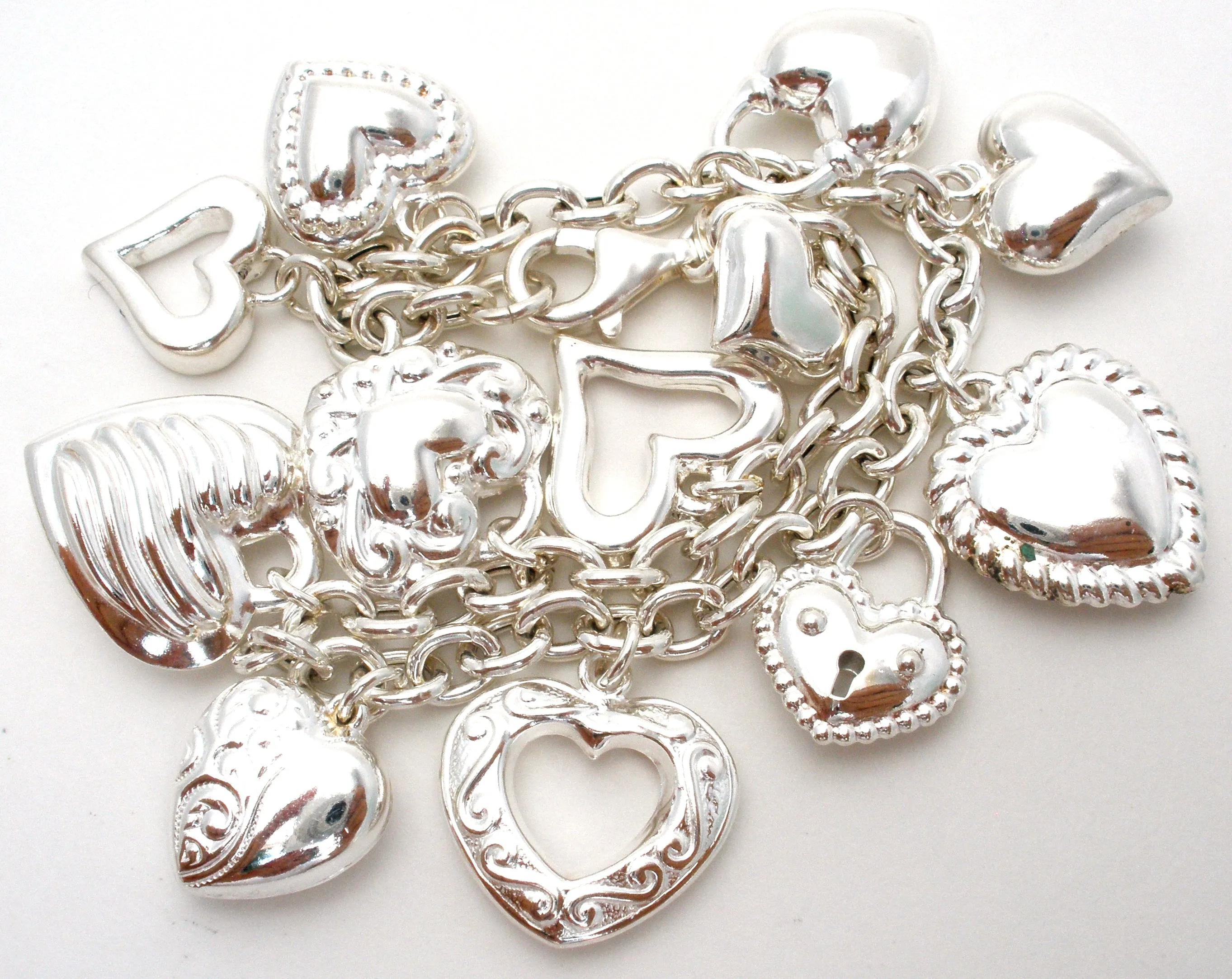 Sterling Silver Charm Bracelet with Hearts JCM