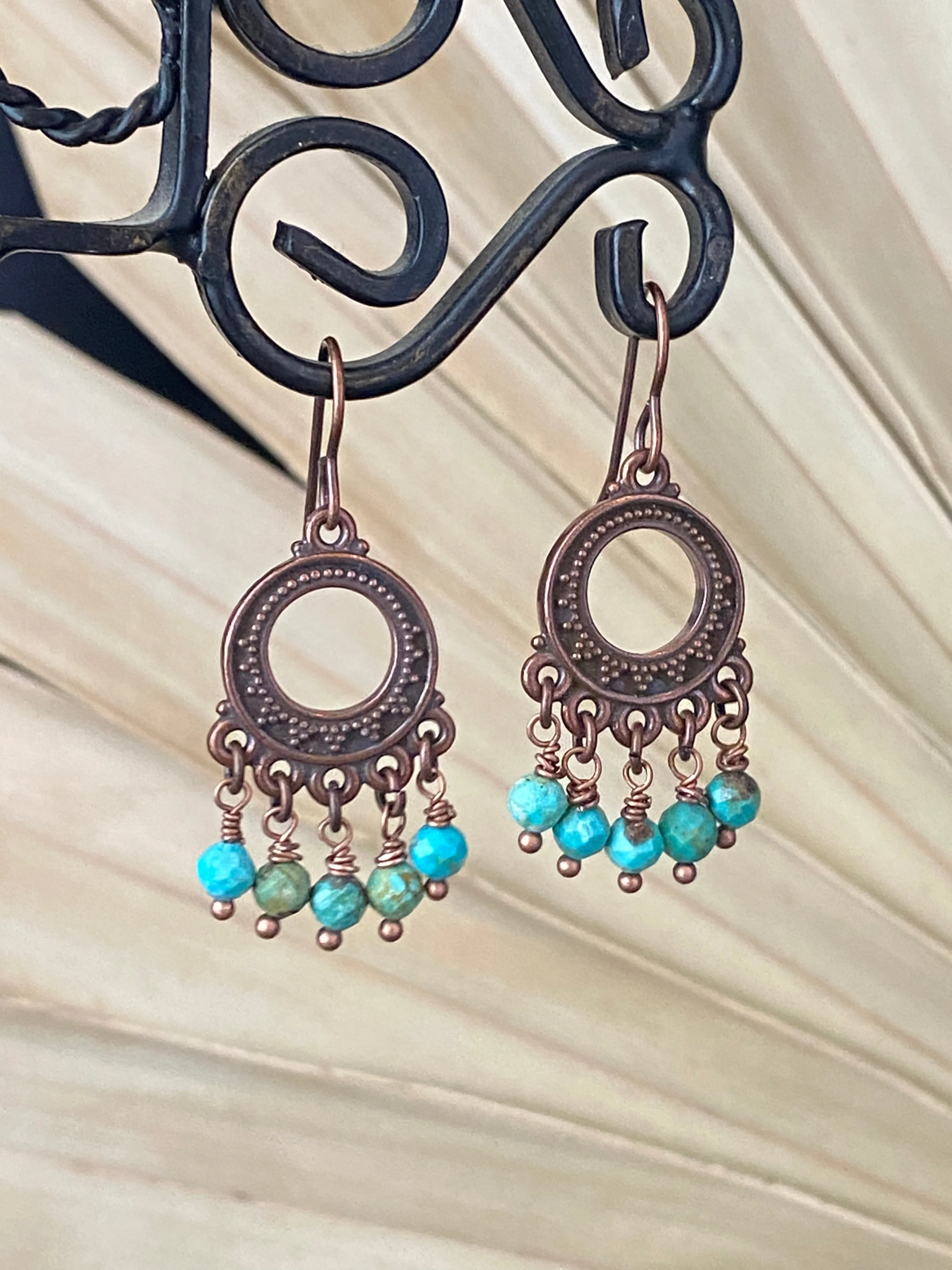 Turquoise stone, copper metal charm, earrings, jewelry.