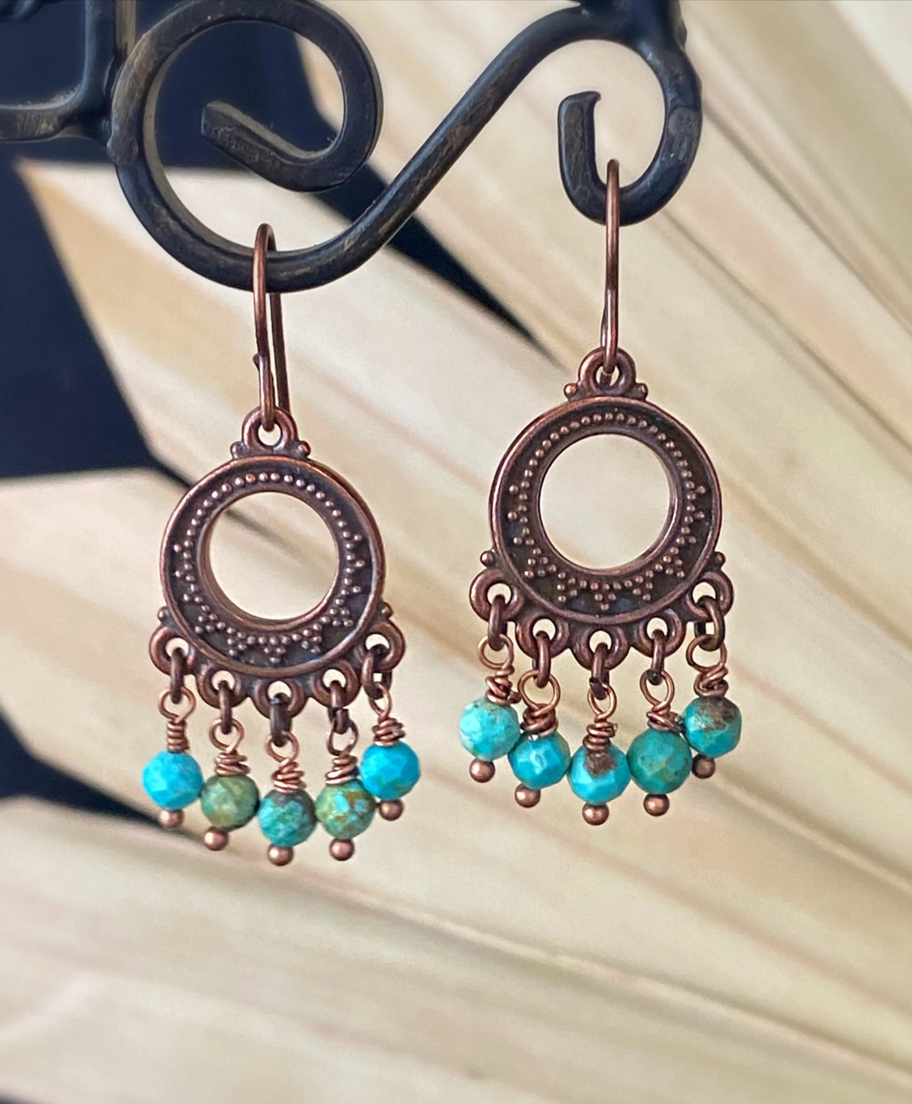 Turquoise stone, copper metal charm, earrings, jewelry.