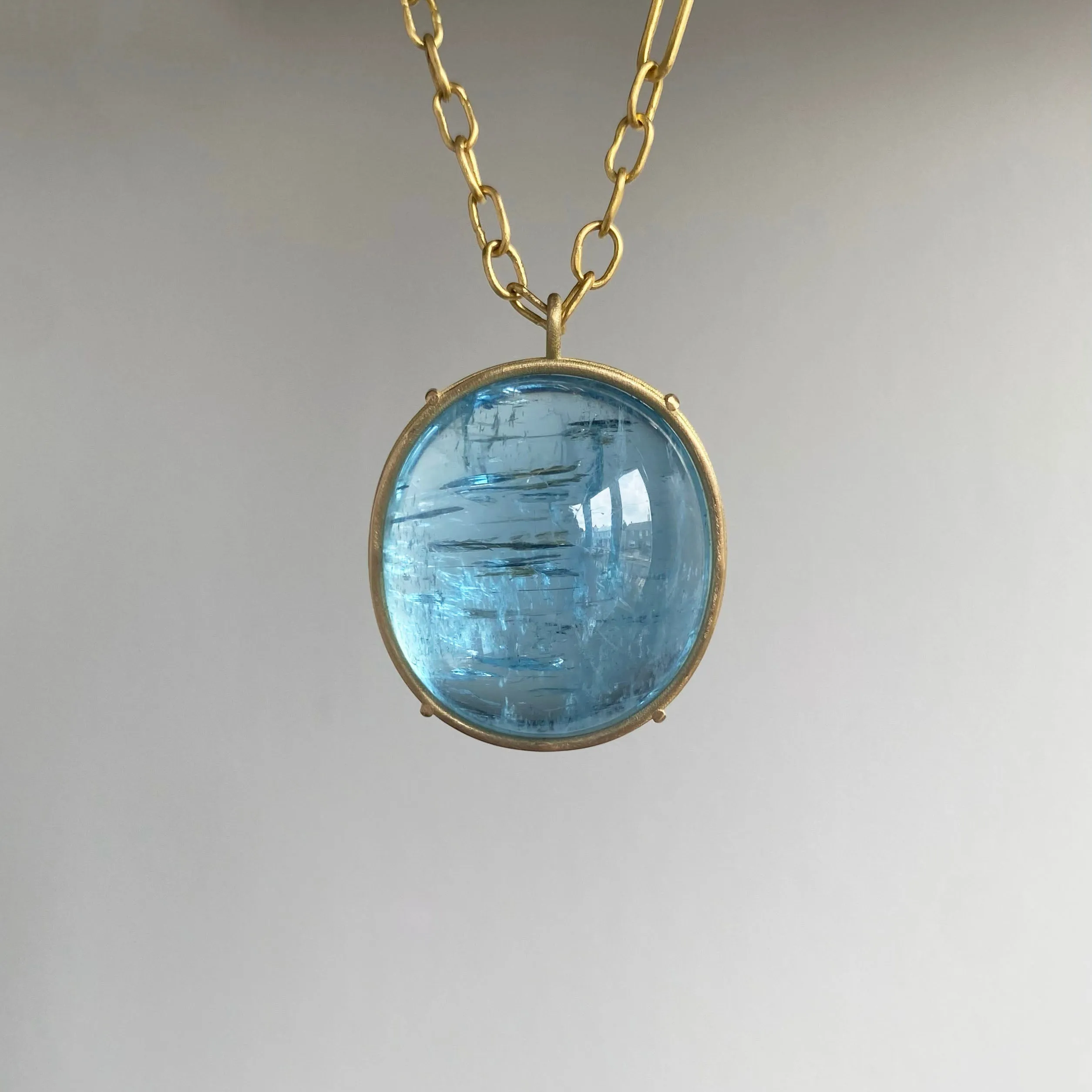 Vivid Aquamarine Cabochon Cage Set Pendant